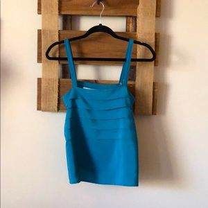 Turquoise sleeveless blouse